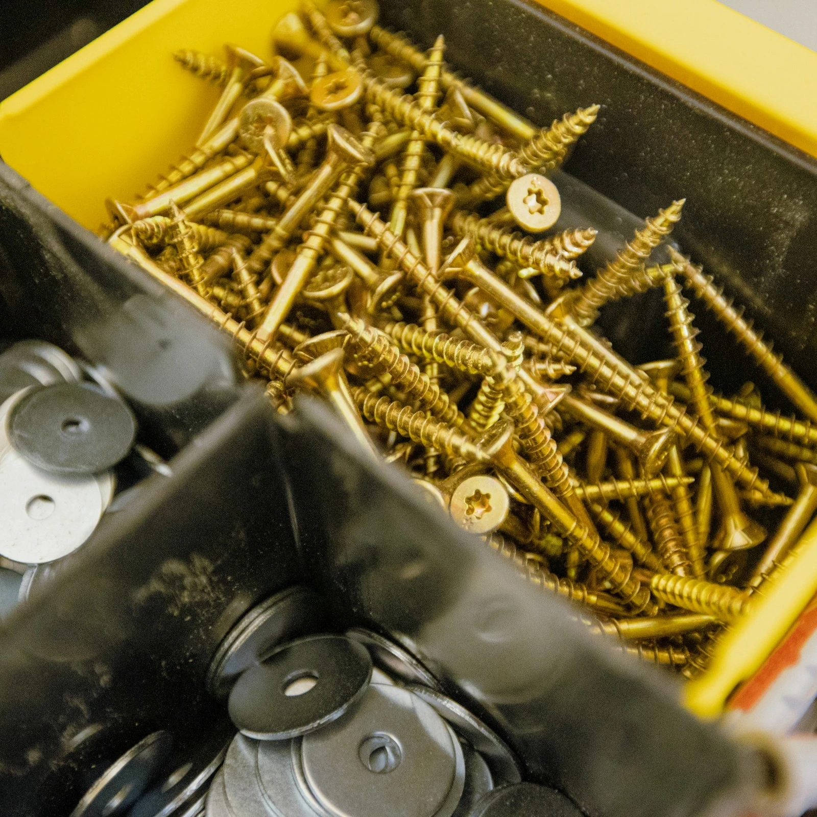 Bulk screws and washers in a toolbox